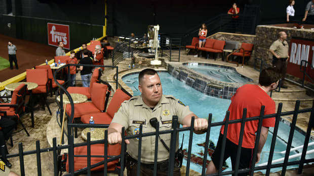 Oct 9, 2017; Phoenix, AZ, USA; Police and venue security guard the pool area following the Los Angeles Dodgers victory against the Arizona Diamondbacks in game three of the 2017 NLDS playoff baseball series at Chase Field. Mandatory Credit: Matt Kartozian-USA TODAY Sports